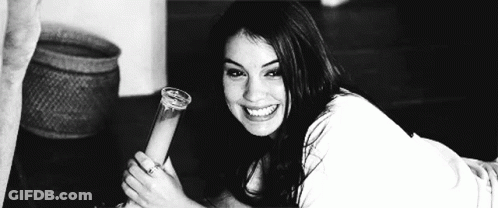 Woman Laying On Floor Holding Bong In Black And White Photo GIF