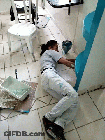 Woman Laying On Floor Painting Wall Blue GIF