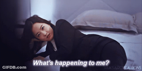 Woman Laying On Floor Saying What's Happening To Me GIF