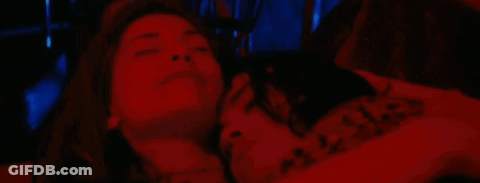 Woman Laying On Man's Chest In Red Light GIF