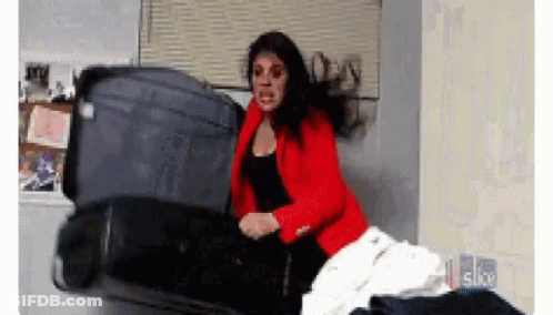 Woman Laying On Stack Of Suitcases Schitts Creek GIF