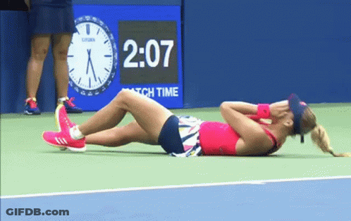 Woman Laying On Tennis Court With Clock 2:07 GIF
