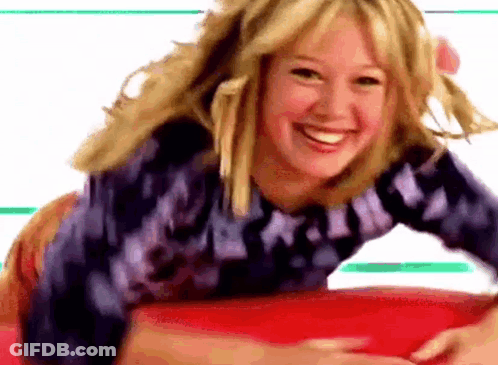 Woman Laying Smiling On Red Surface GIF