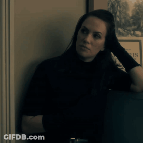 Woman Leaning Against Wall Saying Paris GIF