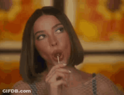 Woman Licking Lollipop GIF