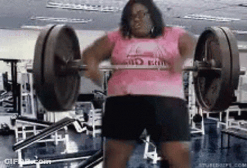 Woman Lifting Barbell In Gym GIF
