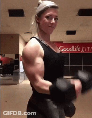 Woman Lifting Dumbbell In Front Of Goodlife Fitn Sign GIF