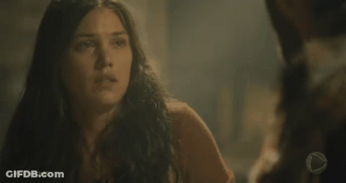 Woman Looking At Another Woman In Dark Room GIF