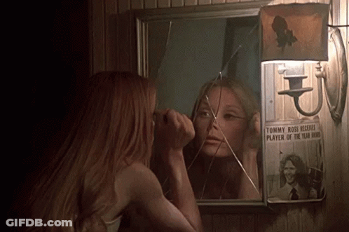 Woman Looking At Broken Mirror With Tommy Boss Picture GIF