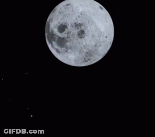 Woman Looking At Camera In Front Of Full Moon GIF