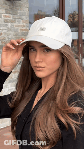 Woman Looking At Camera White New Balance Hat GIF