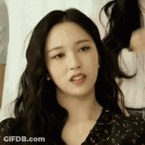 Woman Looking At Camera With Long Black Hair GIF