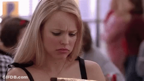 Woman Looking At Chocolate Cake In Crowded Room GIF