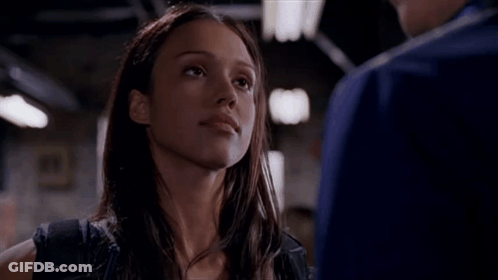 Woman Looking At Man In Dark Room GIF