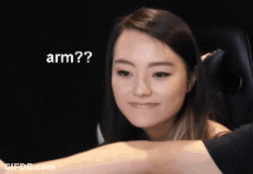 Woman Looking At Man's Arm Saying Arm GIF