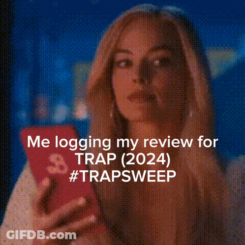 Woman Looking At Phone Me Logging My Review For Trap 2024 GIF