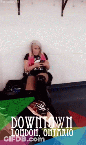 Woman Looking At Phone On Couch Downtown London Ontario GIF
