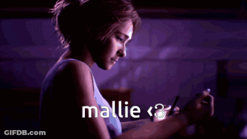 Woman Looking At Phone With Mallie < 3 GIF
