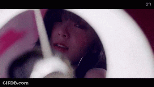 Woman Looking At Reflection In Mirror GIF
