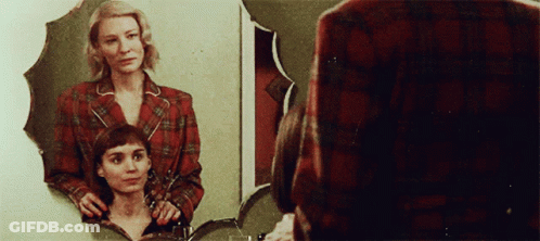Woman Looking At Reflection In Mirror GIF