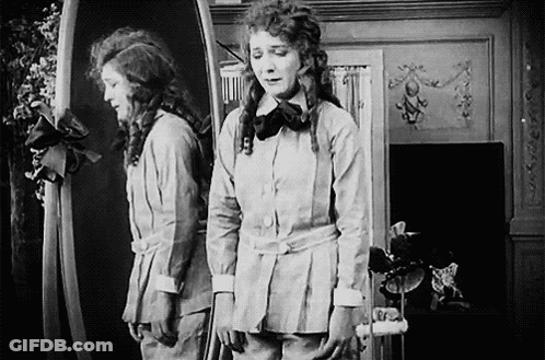 Woman Looking In Mirror GIF