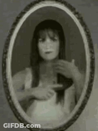 Woman Looking In Mirror GIF