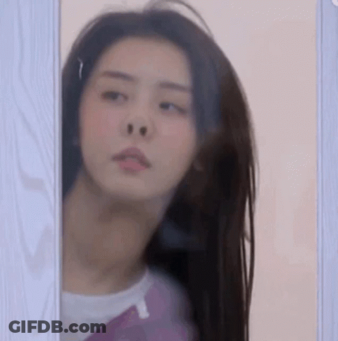 Woman Looking Out Window GIF
