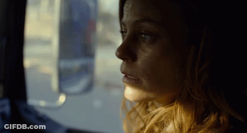 Woman Looking Out Window GIF