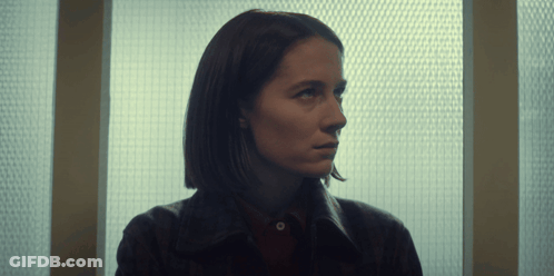 Woman Looking Out Window With Grid GIF