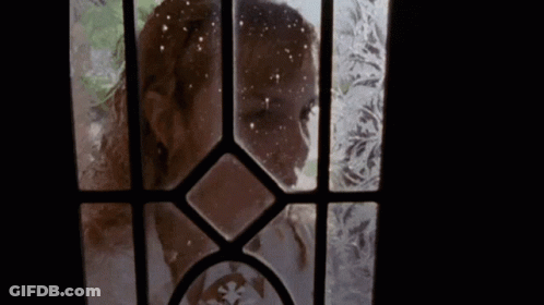 Woman Looking Through Frosted Glass Door GIF