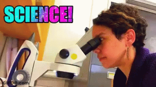 Woman Looking Through Microscope Saying Science GIF