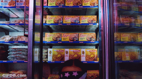 Woman Looking Through Refrigerator Full Of Eggs And Waffles GIF