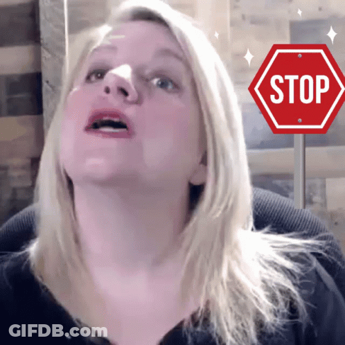 Woman Looking Up At Stop Sign GIF