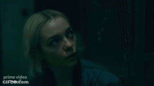 Woman Looking Up In Dark Room GIF