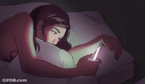 Woman Lying In Bed Looking At Cell Phone GIF