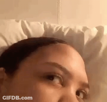 Woman Lying In Bed With White Pillow GIF