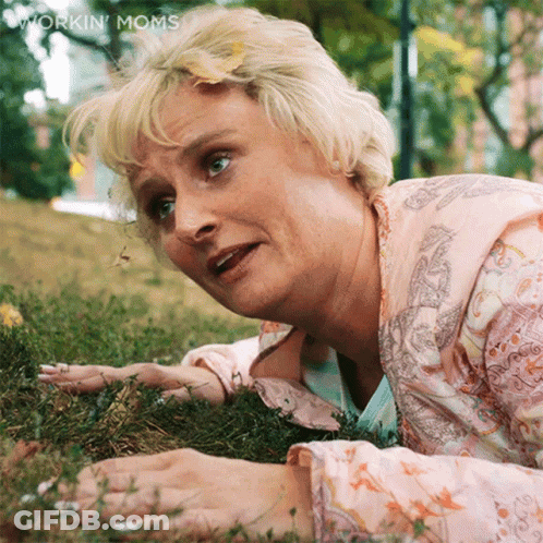 Woman Lying In Grass Workin Moms GIF