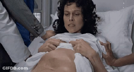 Woman Lying In Hospital Bed Being Examined GIF