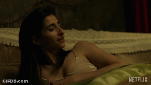 Woman Lying On Bed With Netflix GIF