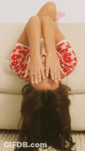 Woman Lying On Couch Covering Face GIF