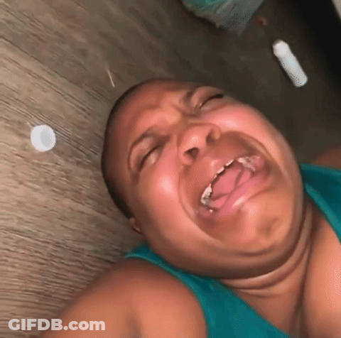 Woman Lying On Floor Making Funny Face GIF