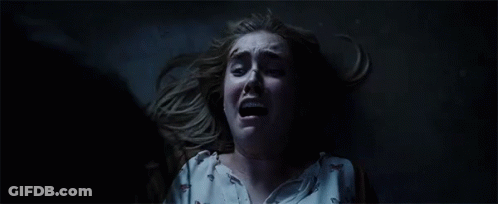 Woman Lying On Floor Mouth Open Dark GIF