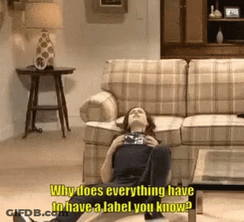 Woman Lying On Floor Saying Why Does Everything Have To Have A Label GIF