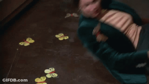 Woman Lying On Floor With Painted Butterflies GIF
