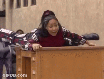 Woman Lying On Wooden Desk With Legs Crossed GIF