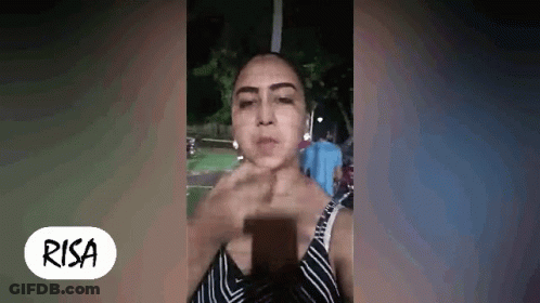 Woman Making Face Holding Cell Phone GIF