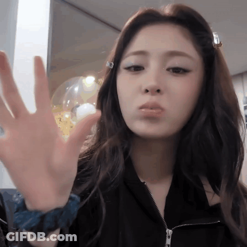 Woman Making Face In Black Jacket And Blue Wristband GIF