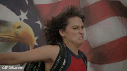 Woman Making Face In Front Of American Flag GIF