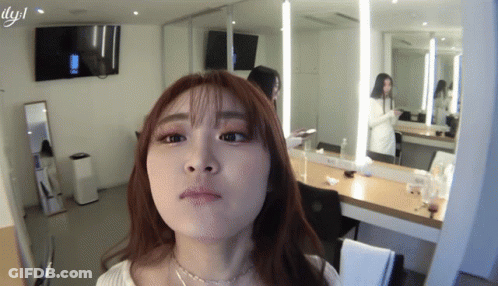 Woman Making Face In Mirror With LYJL GIF