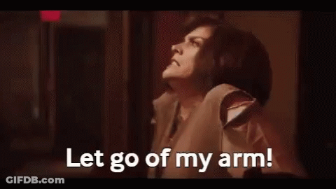 Woman Making Face Saying Let Go Of My Arm GIF